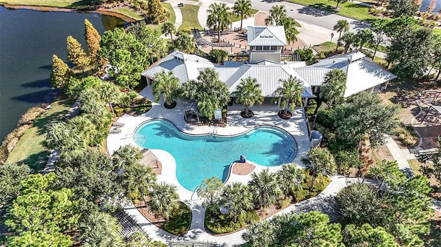 an aerial view of a house with a yard