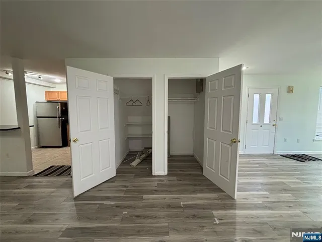 a view of a livingroom with wooden floor
