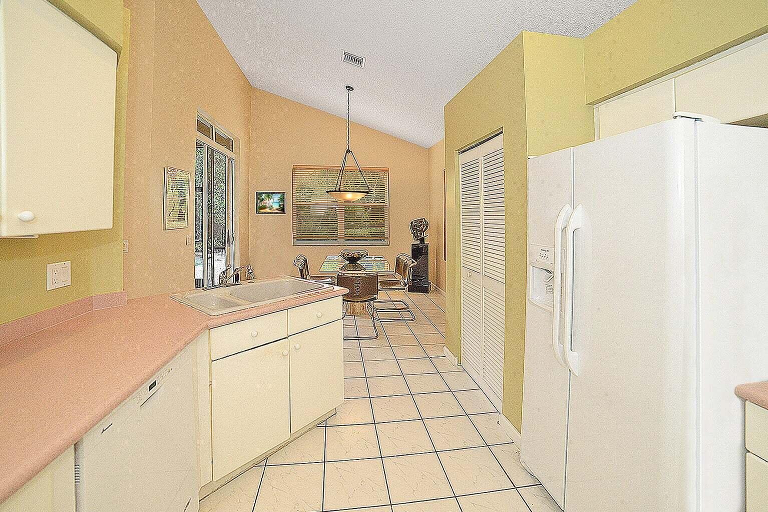 6695 Northwest 25th Court Boca Raton, FL 33496 - Photo 10 of 40 a room with a washing machine and a sink