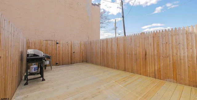 a view of a room with wooden floor and chair