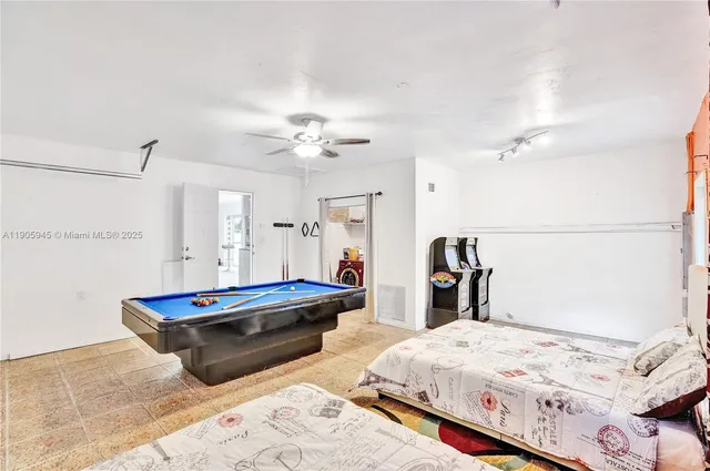 a bedroom with bed and window