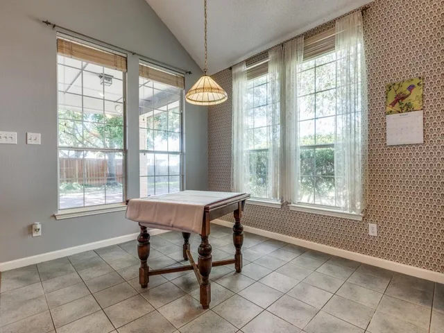 a house that has a bench and a table in it