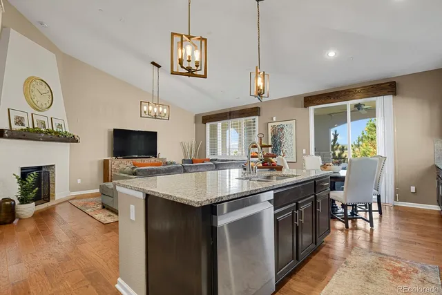 a view of kitchen island with stainless steel appliances refrigerator stove and microwave