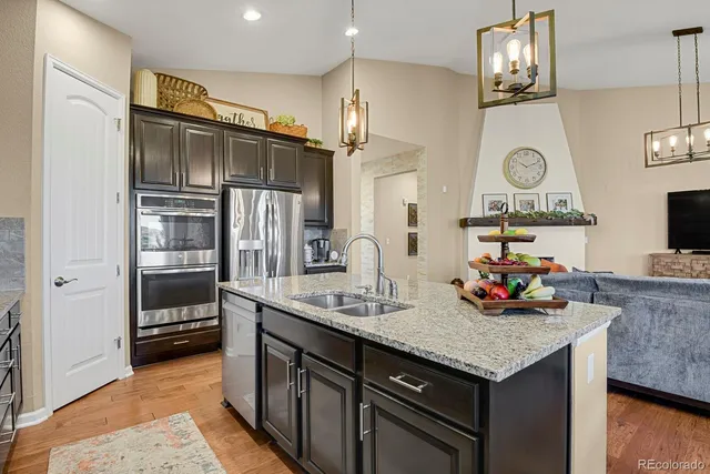a kitchen with cabinets and stainless steel appliances
