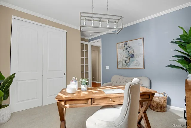 a dining room with a table and chairs