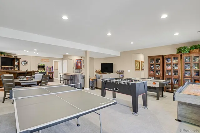 a living room with lots of furniture and kitchen view