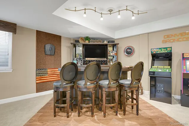 a view of a dining room with furniture and wooden floor