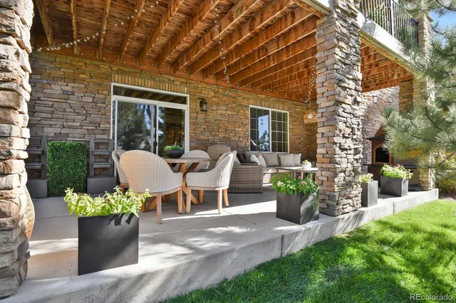 a view of a patio with chair and potted plants
