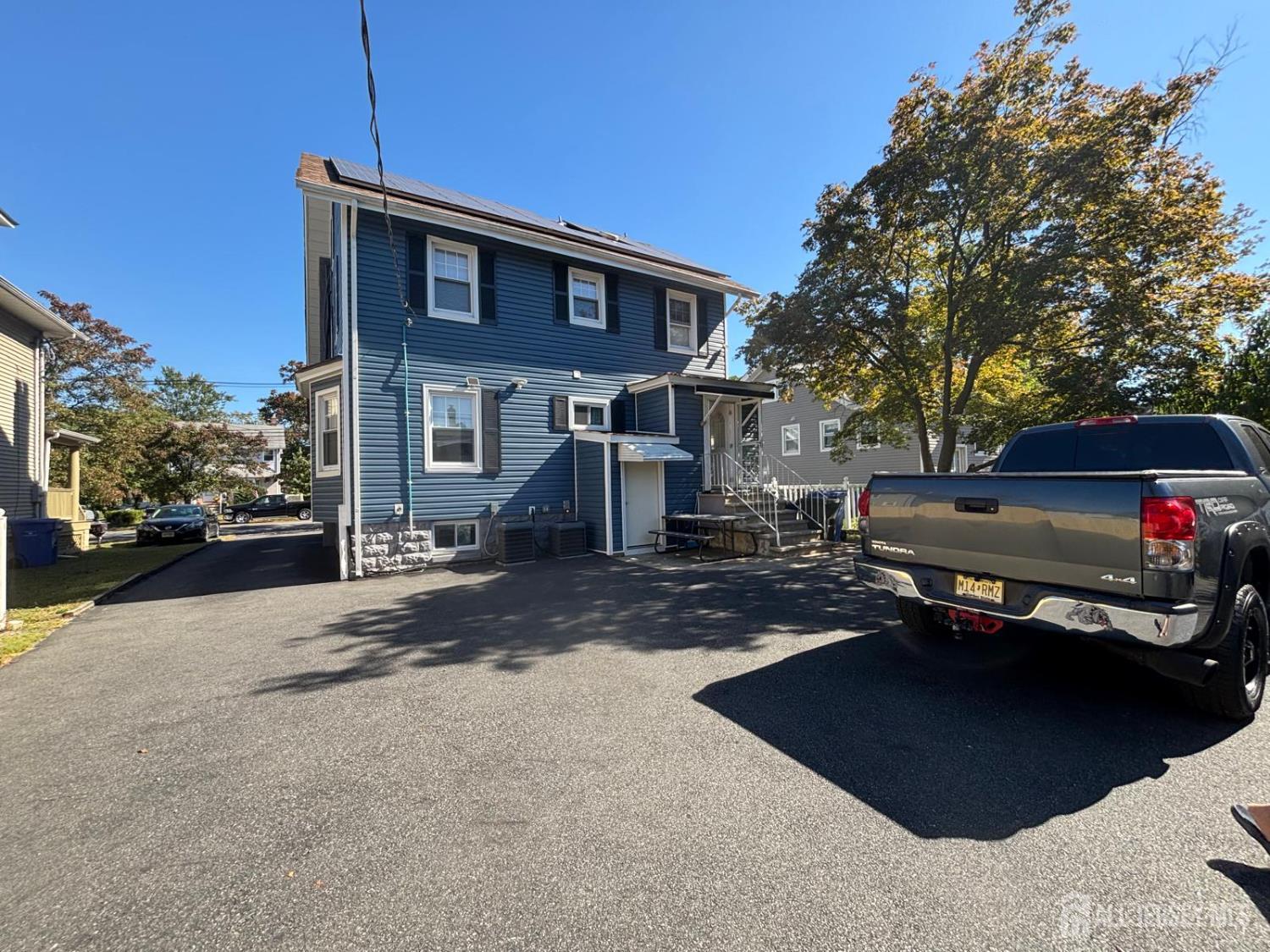 220 South Washington Avenue Dunellen, NJ 08812 - Photo 16 of 21 a view of a car park in front of house