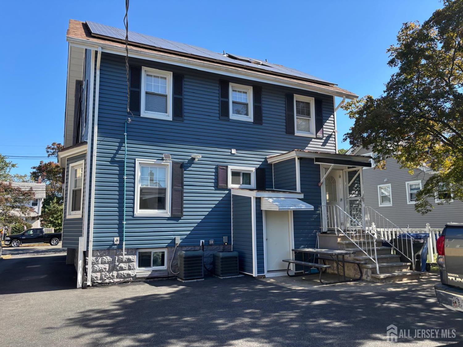 220 South Washington Avenue Dunellen, NJ 08812 - Photo 17 of 21 a front view of a house with a yard