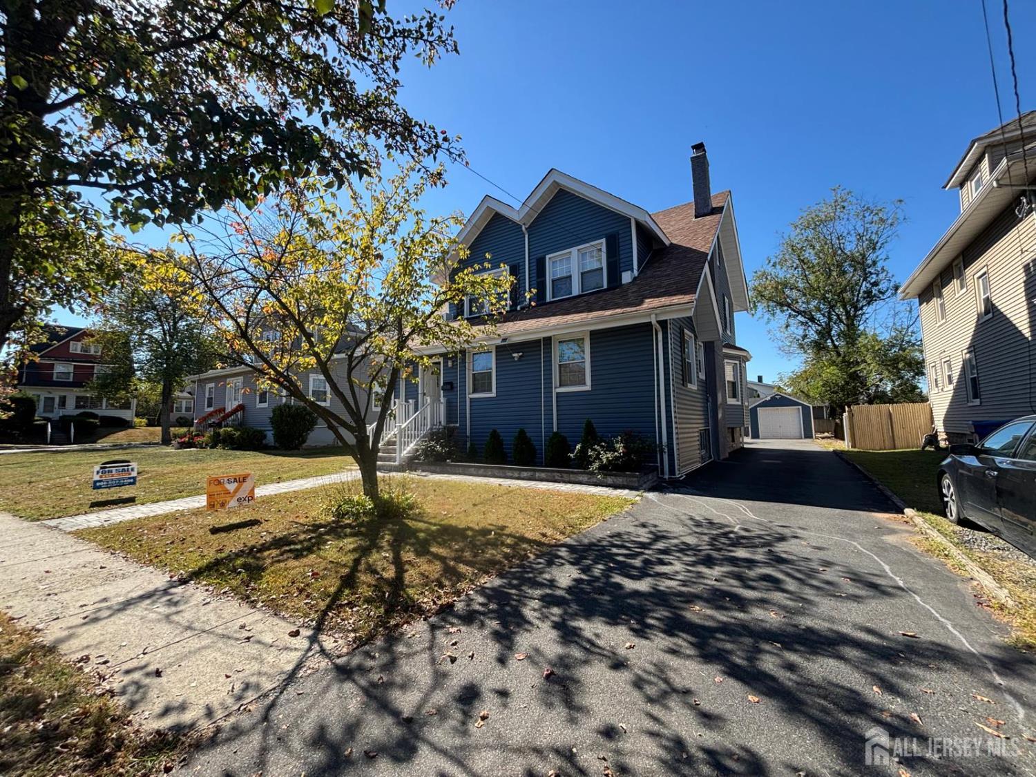 220 South Washington Avenue Dunellen, NJ 08812 - Photo 19 of 21 a front view of a house with a yard