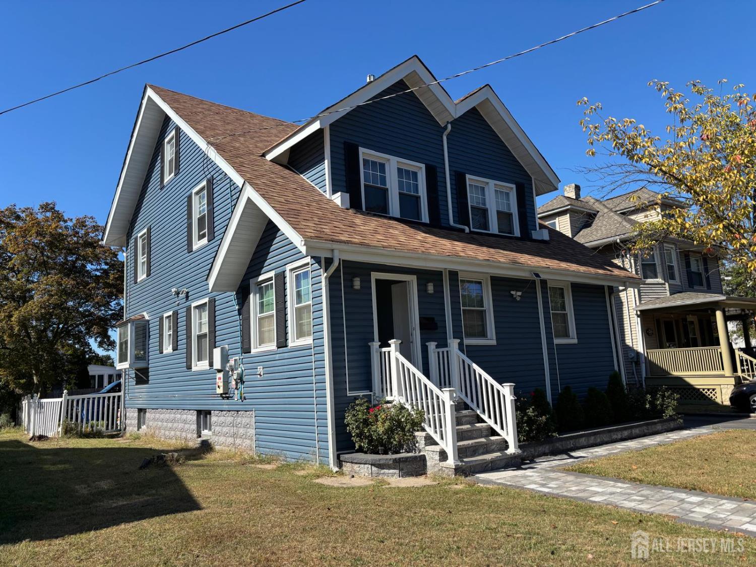 220 South Washington Avenue Dunellen, NJ 08812 - Photo 20 of 21 a front view of a house with a yard
