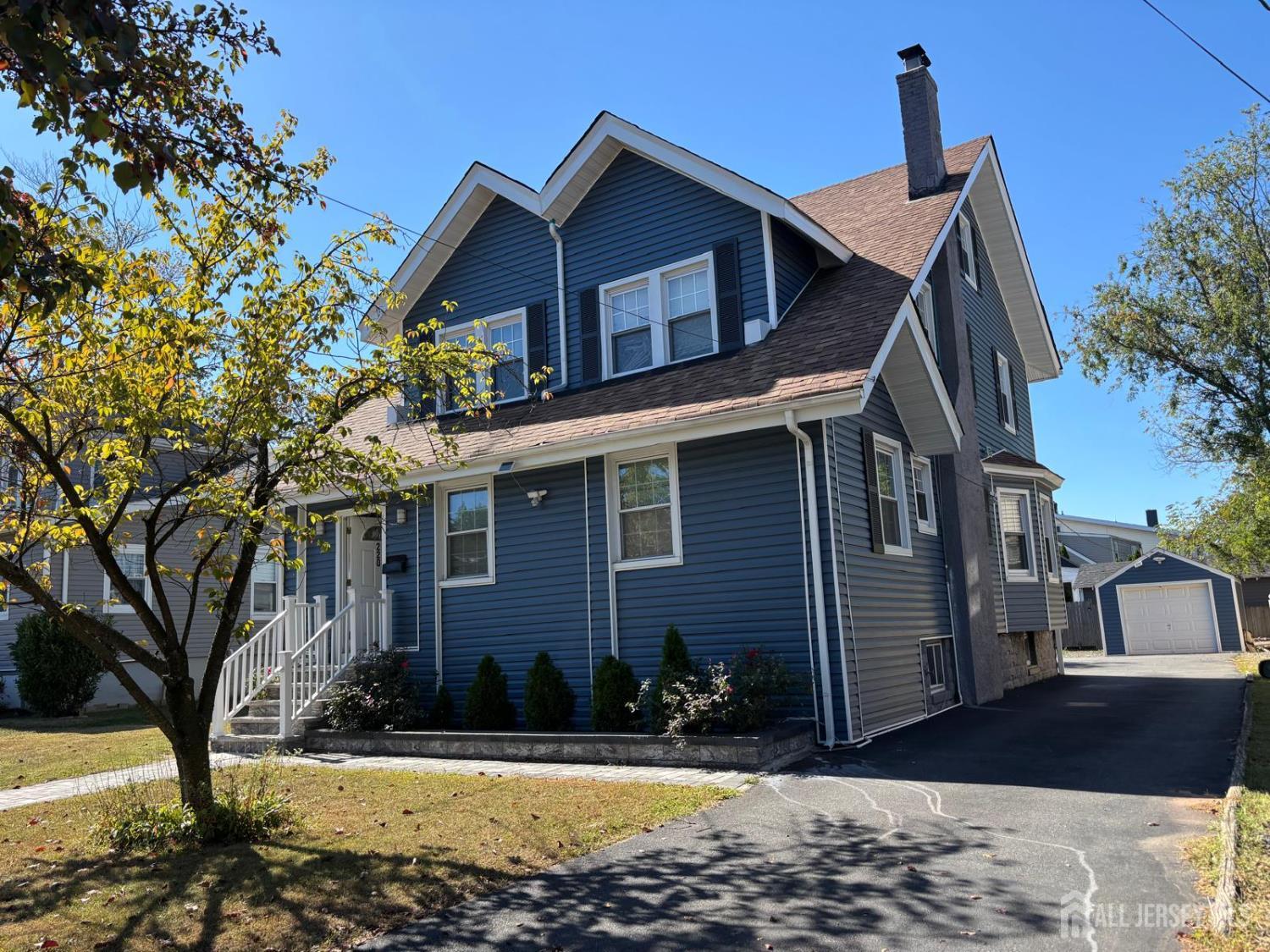 220 South Washington Avenue Dunellen, NJ 08812 - Photo 2 of 21 a view of a house with a yard