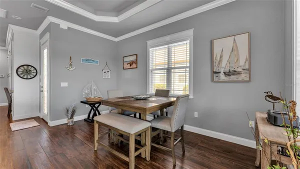 a view of a dining room with furniture and a fireplace