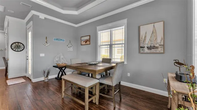 a view of a dining room with furniture and a fireplace