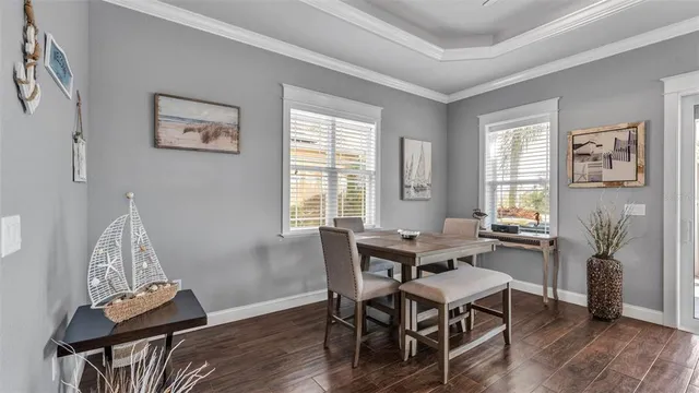 a view of cabinets with wooden floor and wall painting