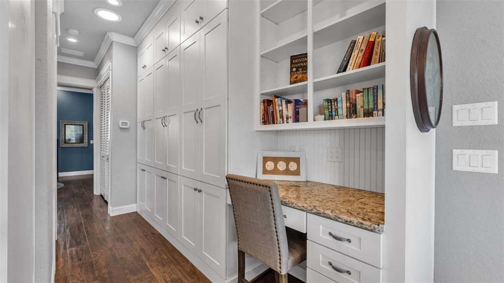 3272 Fish Hawk Drive Polk City, FL 33868 - Photo 24 of 38 a view of cabinets with wooden floor and wall painting