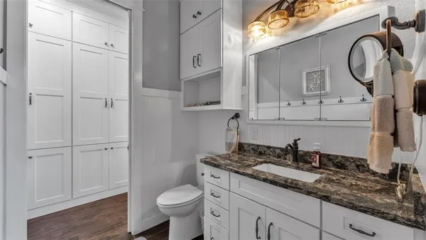 a bathroom with a glass shower door