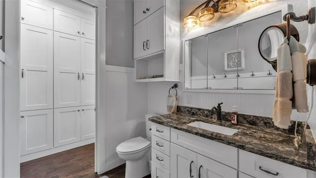 a bathroom with a glass shower door