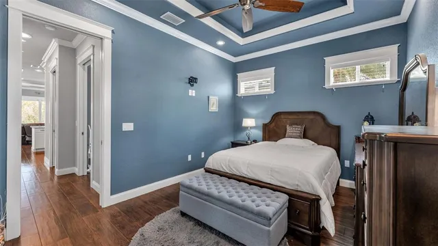 a bedroom with a bed and a flat tv screen