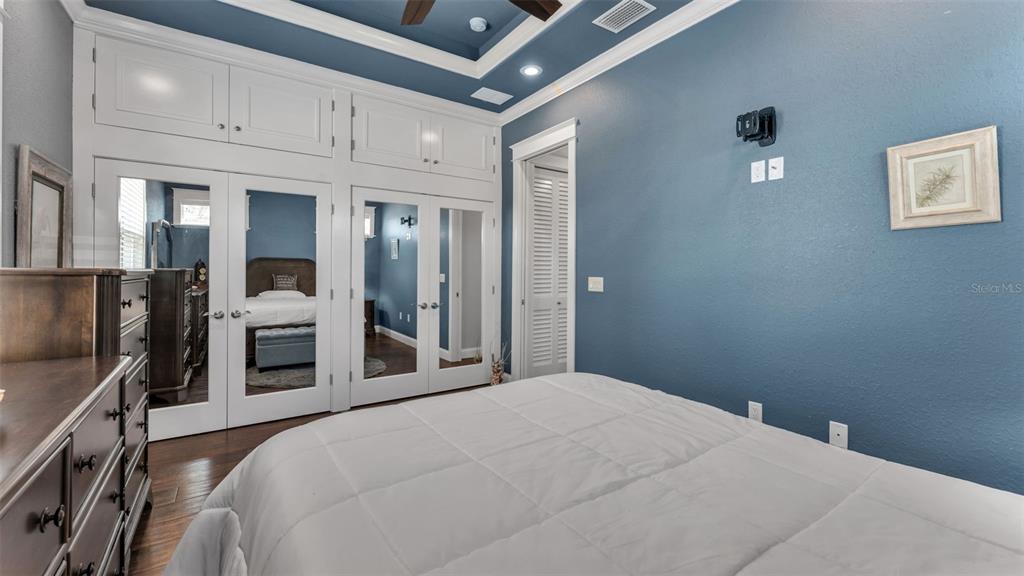 3272 Fish Hawk Drive Polk City, FL 33868 - Photo 33 of 38 a bedroom with a bed and a flat tv screen