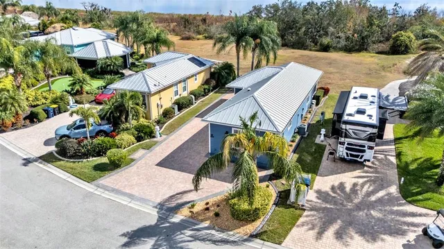 an aerial view of houses with yard