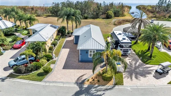 an aerial view of houses with yard