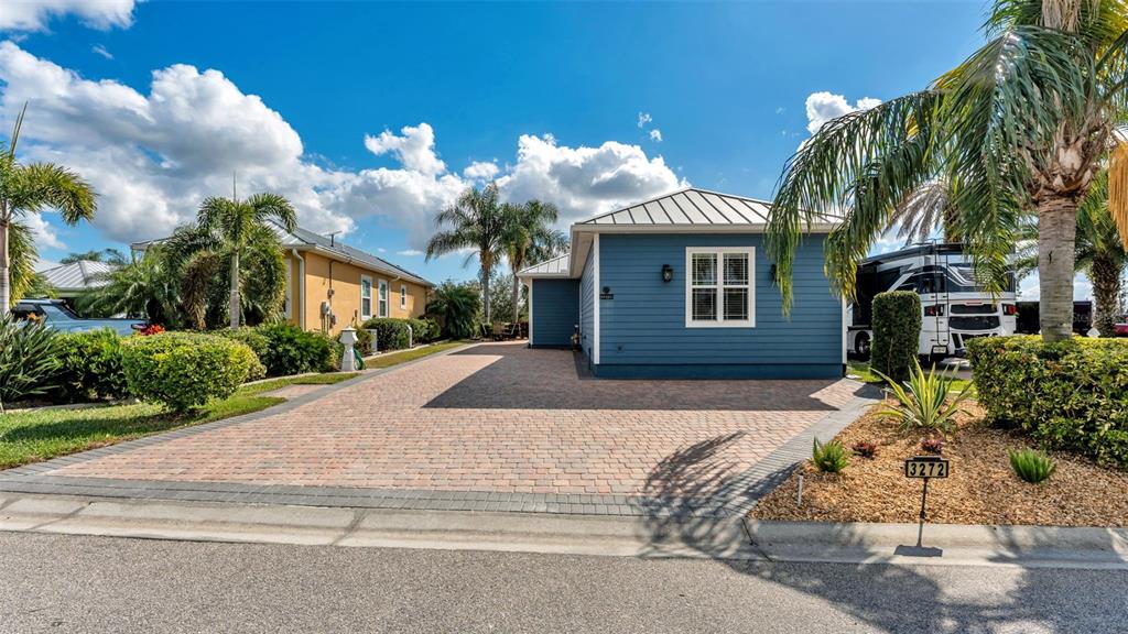 3272 Fish Hawk Drive Polk City, FL 33868 - Photo 7 of 38 a front view of a house with a yard