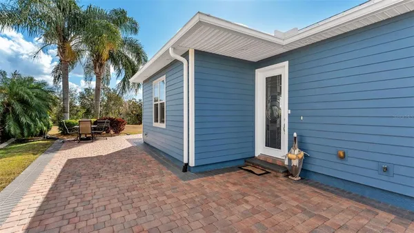 a kitchen with refrigerator and cabinets