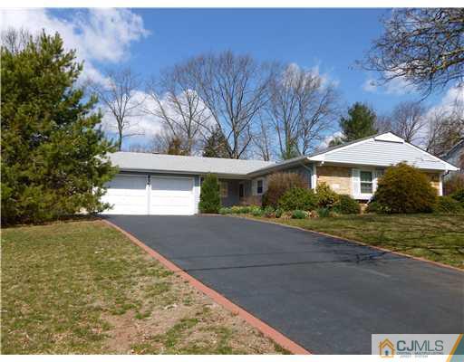 24 Summerall Road Somerset, NJ 08873 - Photo 1 of 24 a front view of a house with a yard and garage
