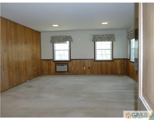 24 Summerall Road Somerset, NJ 08873 - Photo 12 of 24 an empty room with windows and cabinet