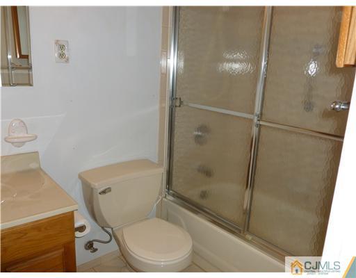 24 Summerall Road Somerset, NJ 08873 - Photo 24 of 24 a bathroom with a toilet and a shower