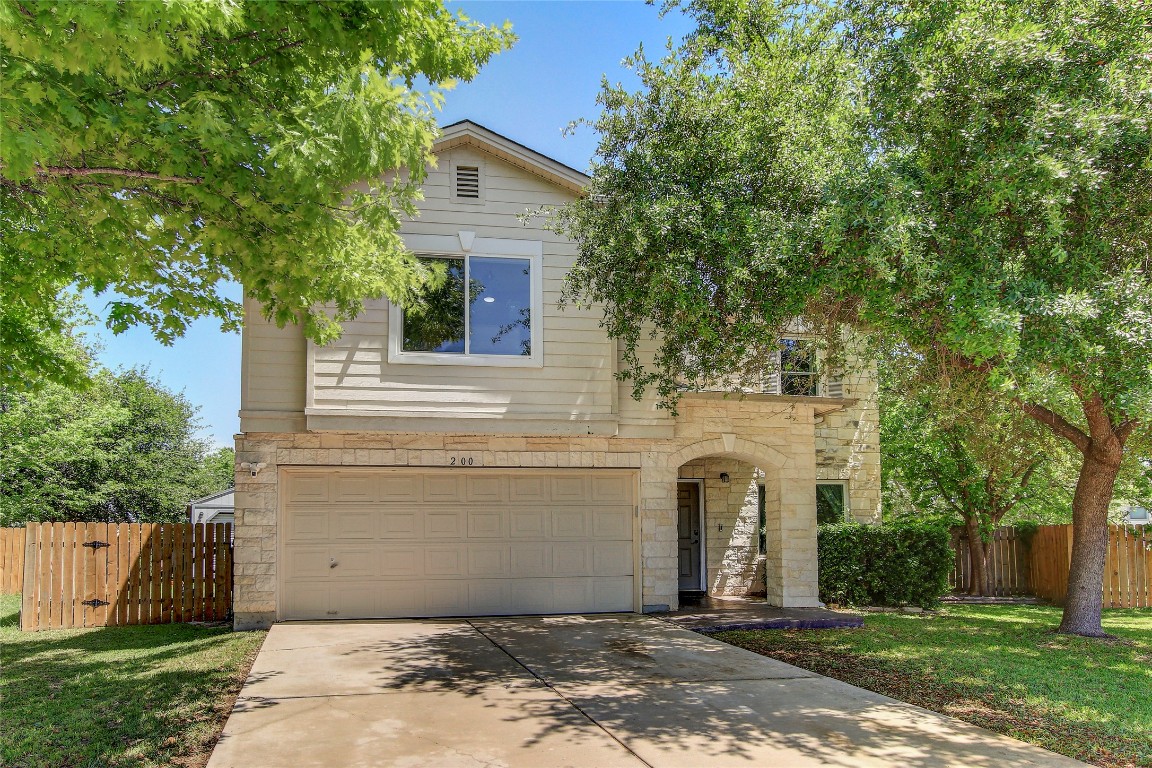 a front view of a house with yard