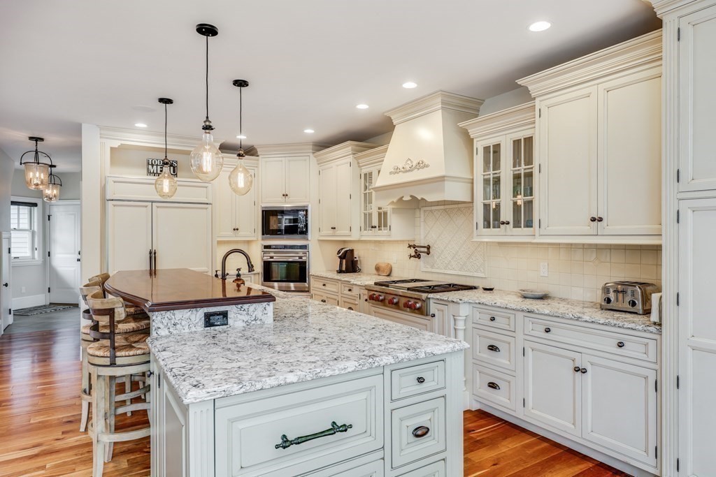 43 Boulder Ridge Plymouth, MA 02360 - Photo 12 of 42 a kitchen with kitchen island granite countertop a sink cabinets and stainless steel appliances