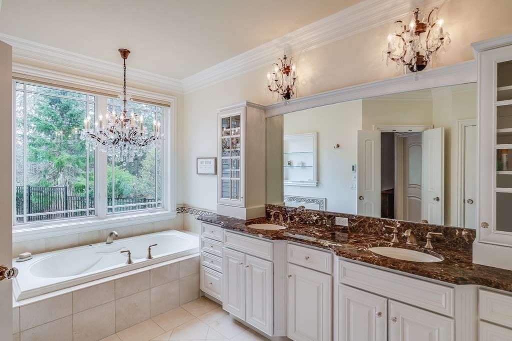 43 Boulder Ridge Plymouth, MA 02360 - Photo 21 of 42 a bathroom with a granite countertop tub a double vanity sink and a mirror