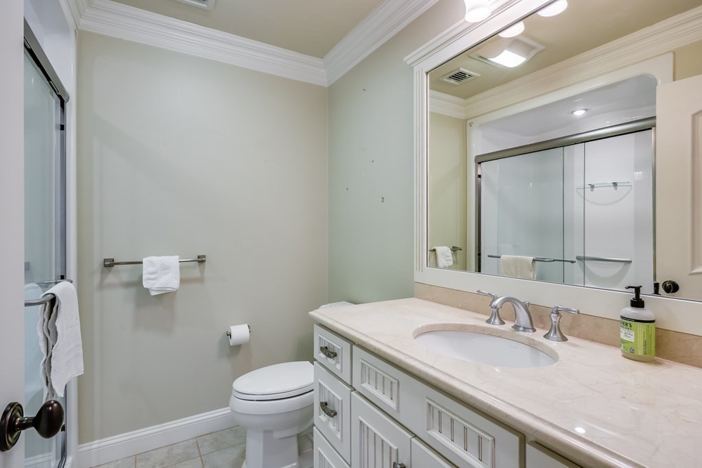43 Boulder Ridge Plymouth, MA 02360 - Photo 27 of 42 a bathroom with a granite countertop sink a toilet and a mirror