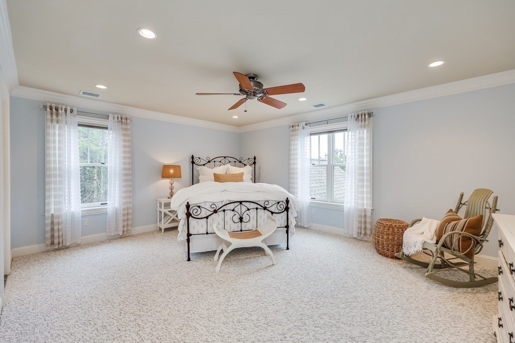 43 Boulder Ridge Plymouth, MA 02360 - Photo 28 of 42 a bedroom with a bed and a chandelier