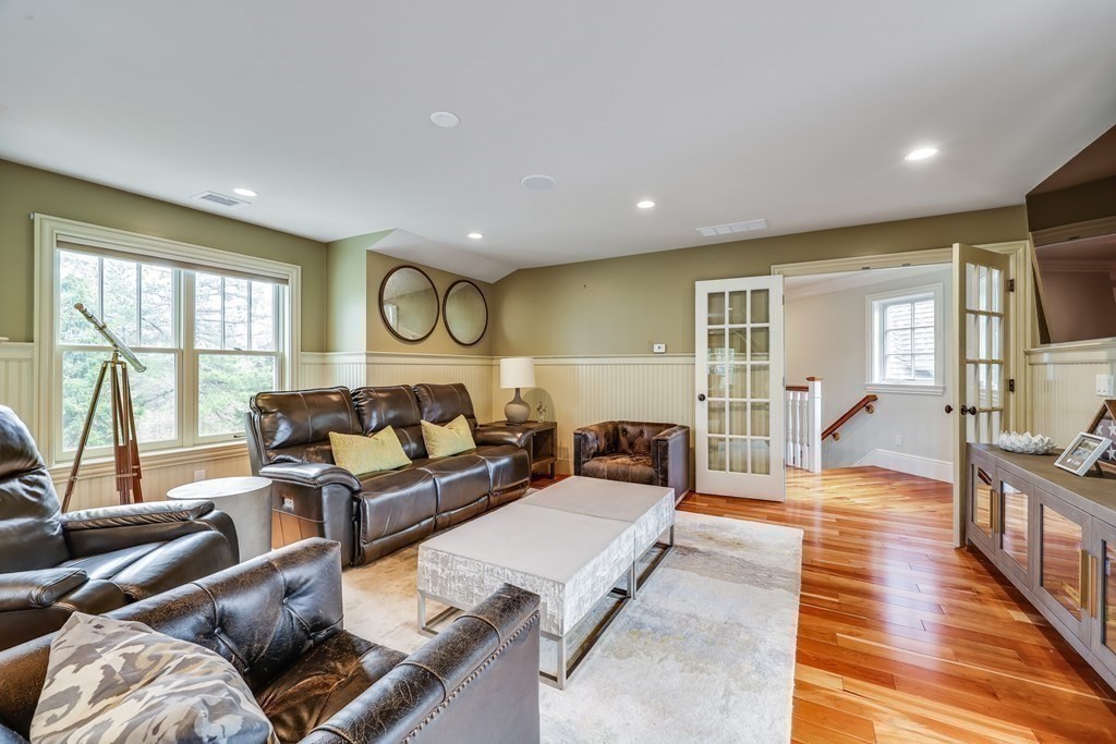 43 Boulder Ridge Plymouth, MA 02360 - Photo 32 of 42 a living room with furniture and a flat screen tv