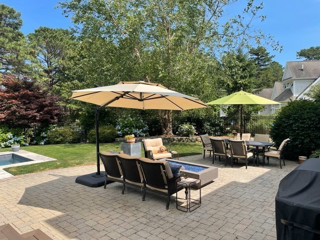 43 Boulder Ridge Plymouth, MA 02360 - Photo 35 of 42 a view of backyard with outdoor seating and trees