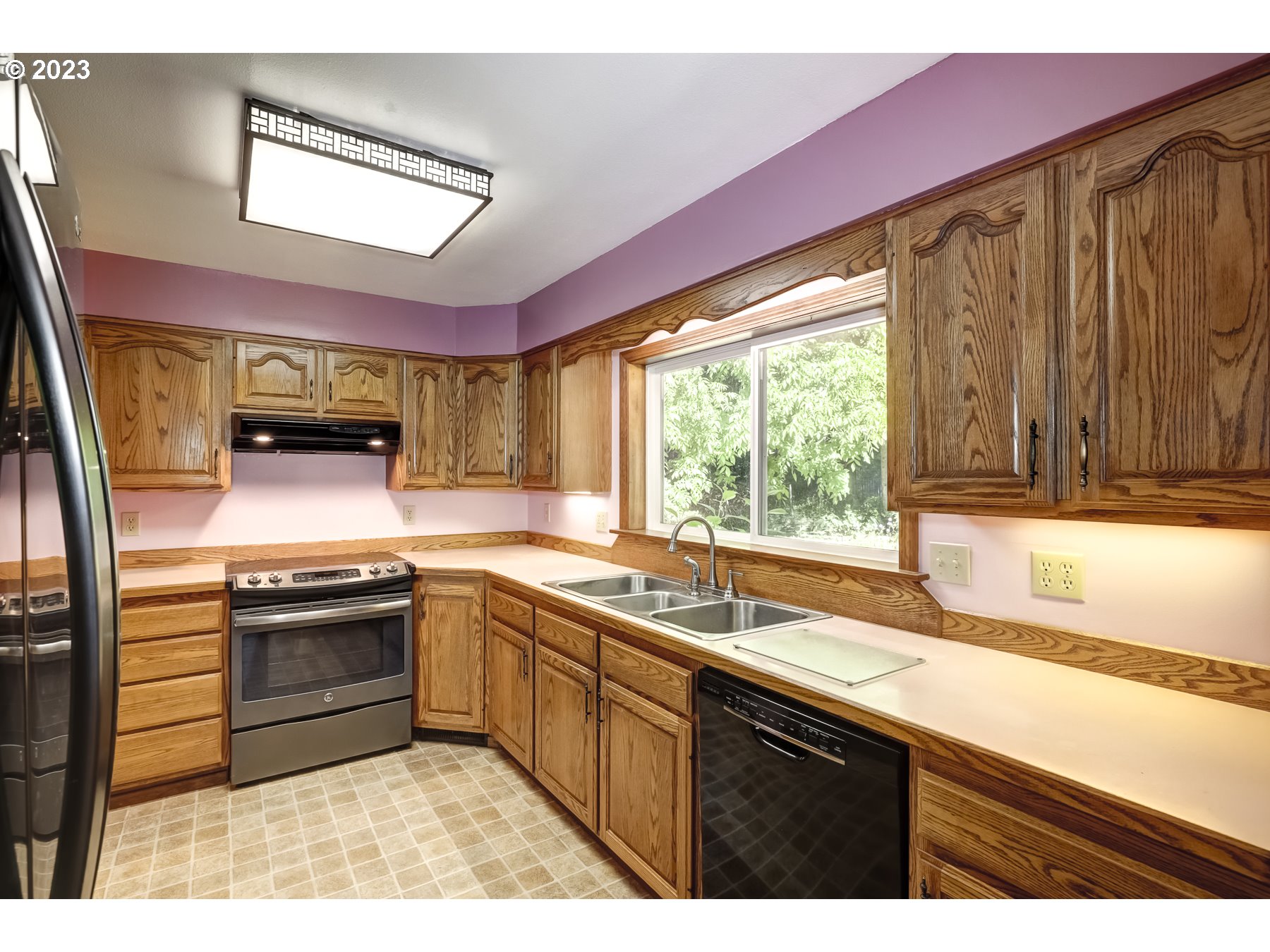 13100 Northwest Willis Road McMinnville, OR 97128 - Photo 13 of 38 a kitchen with stainless steel appliances granite countertop a sink and a stove