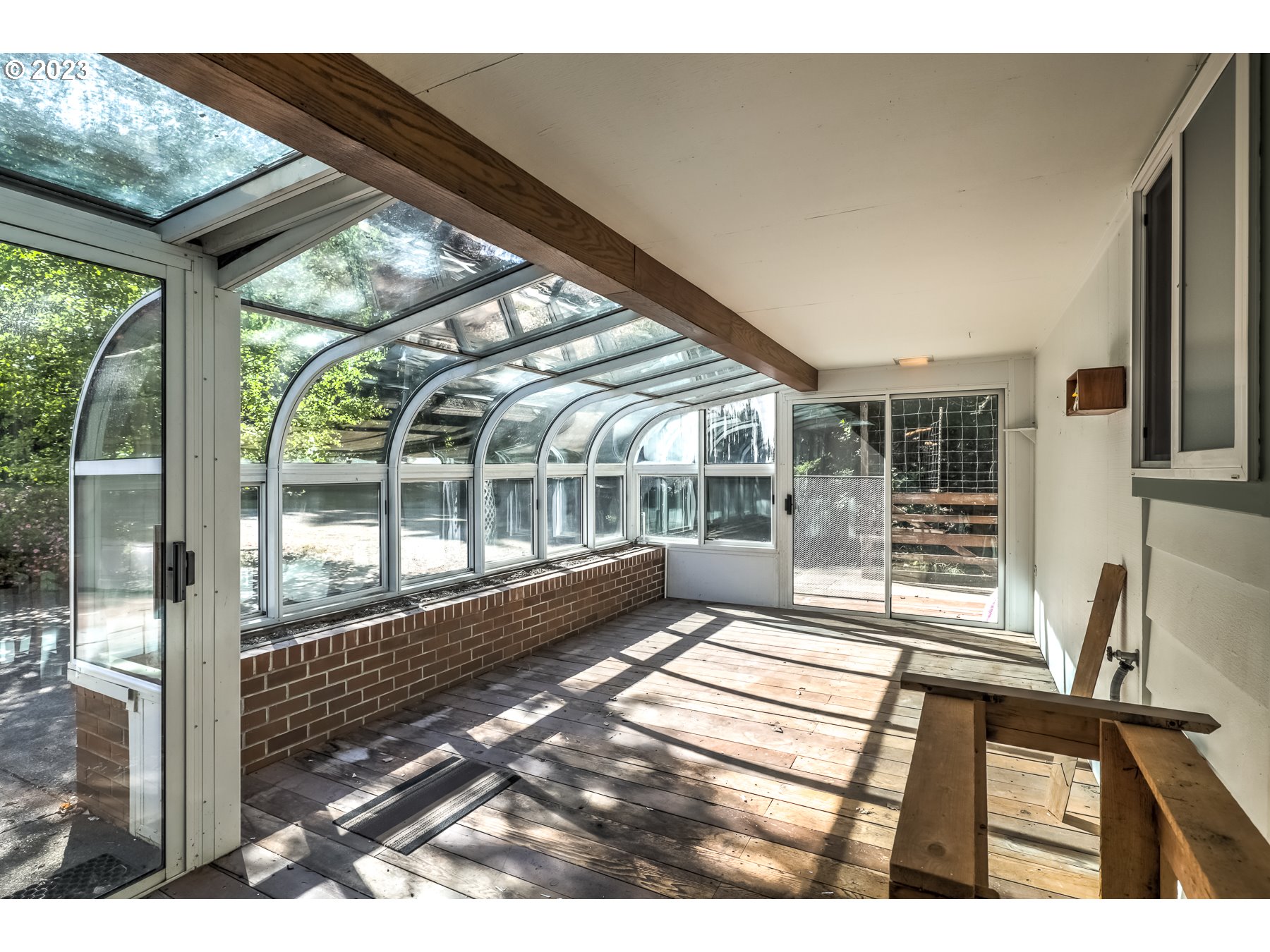 13100 Northwest Willis Road McMinnville, OR 97128 - Photo 19 of 38 a view of a porch with chairs and floor to ceiling window