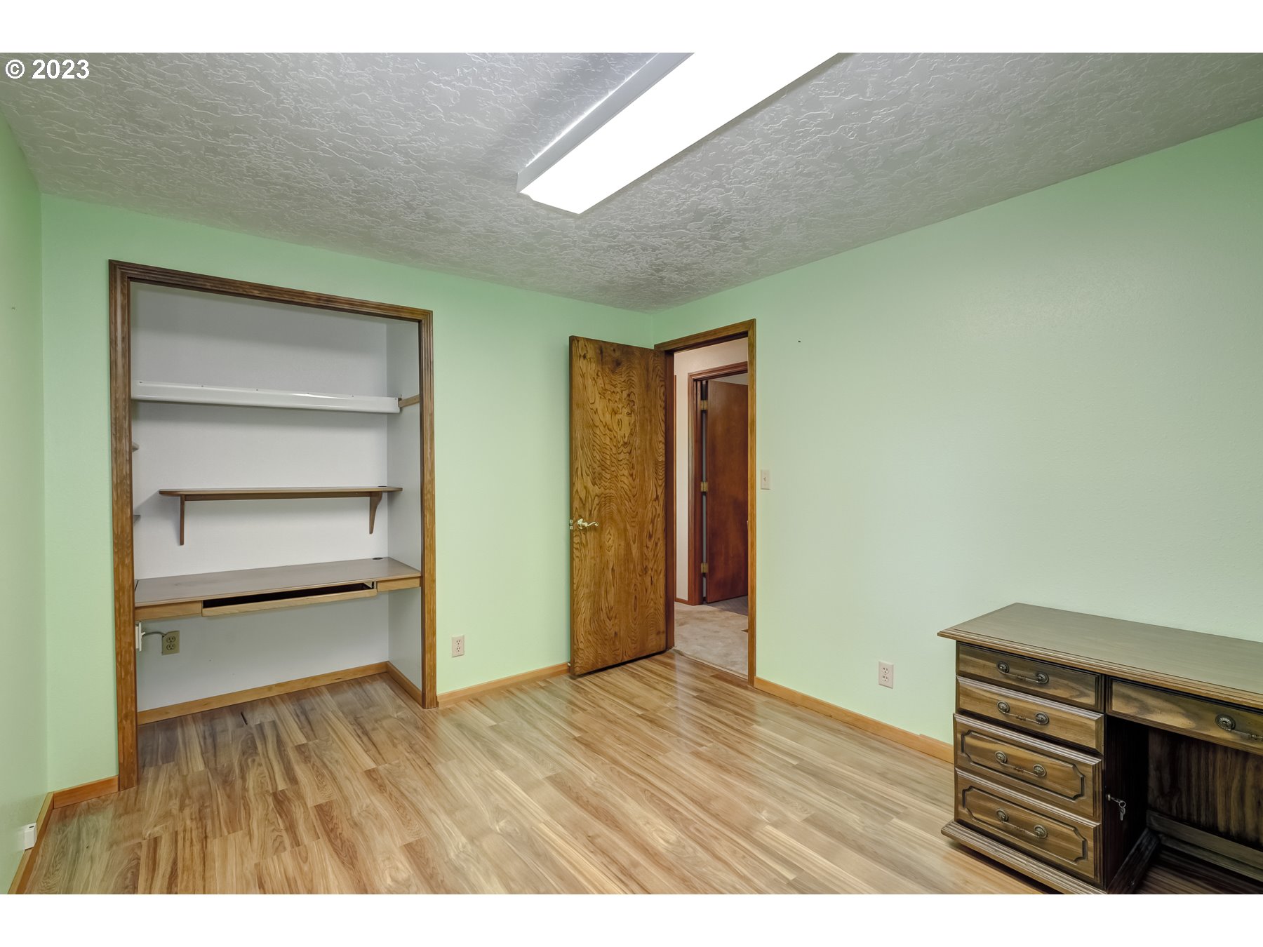 13100 Northwest Willis Road McMinnville, OR 97128 - Photo 23 of 38 a room with walk in closet and wooden floor