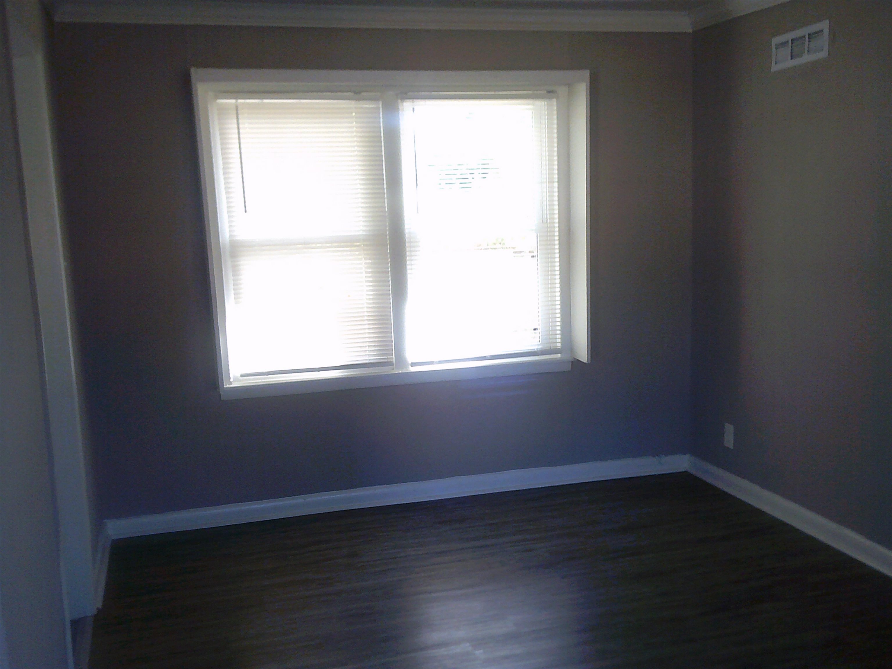 253 East Raines Road Memphis, TN 38109 - Photo 9 of 14 Unfurnished room with dark wood-type flooring and ornamental molding