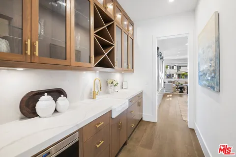 a stove top oven sitting inside of a kitchen