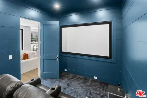 a bathroom with a sink a window and a mirror