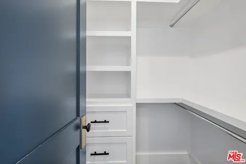 a picture of a bathroom with a shower