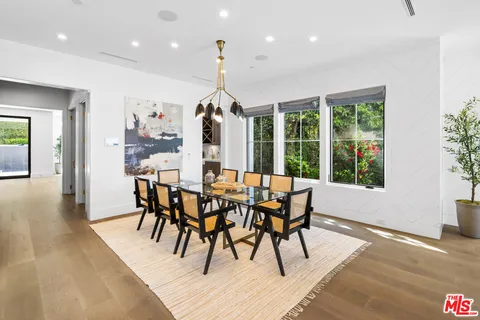 a living room with furniture and flowers