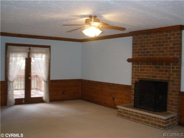 10751 Timberun Road Chesterfield, VA 23832 - Photo 5 of 10 a living room with a fireplace
