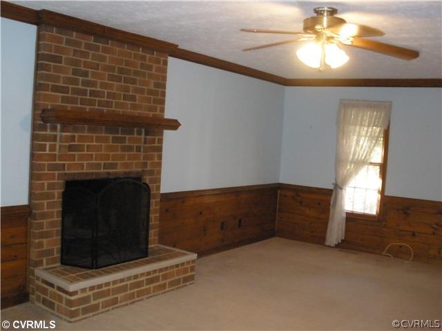 10751 Timberun Road Chesterfield, VA 23832 - Photo 6 of 10 a living room with furniture and a fireplace
