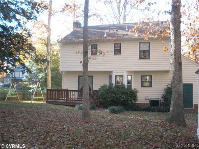 10751 Timberun Road Chesterfield, VA 23832 - Photo 9 of 10 a view of a house with a yard and plants